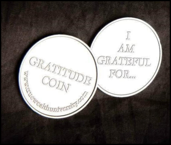 2 coins that has gratitude coin and I am grateful for..written on them