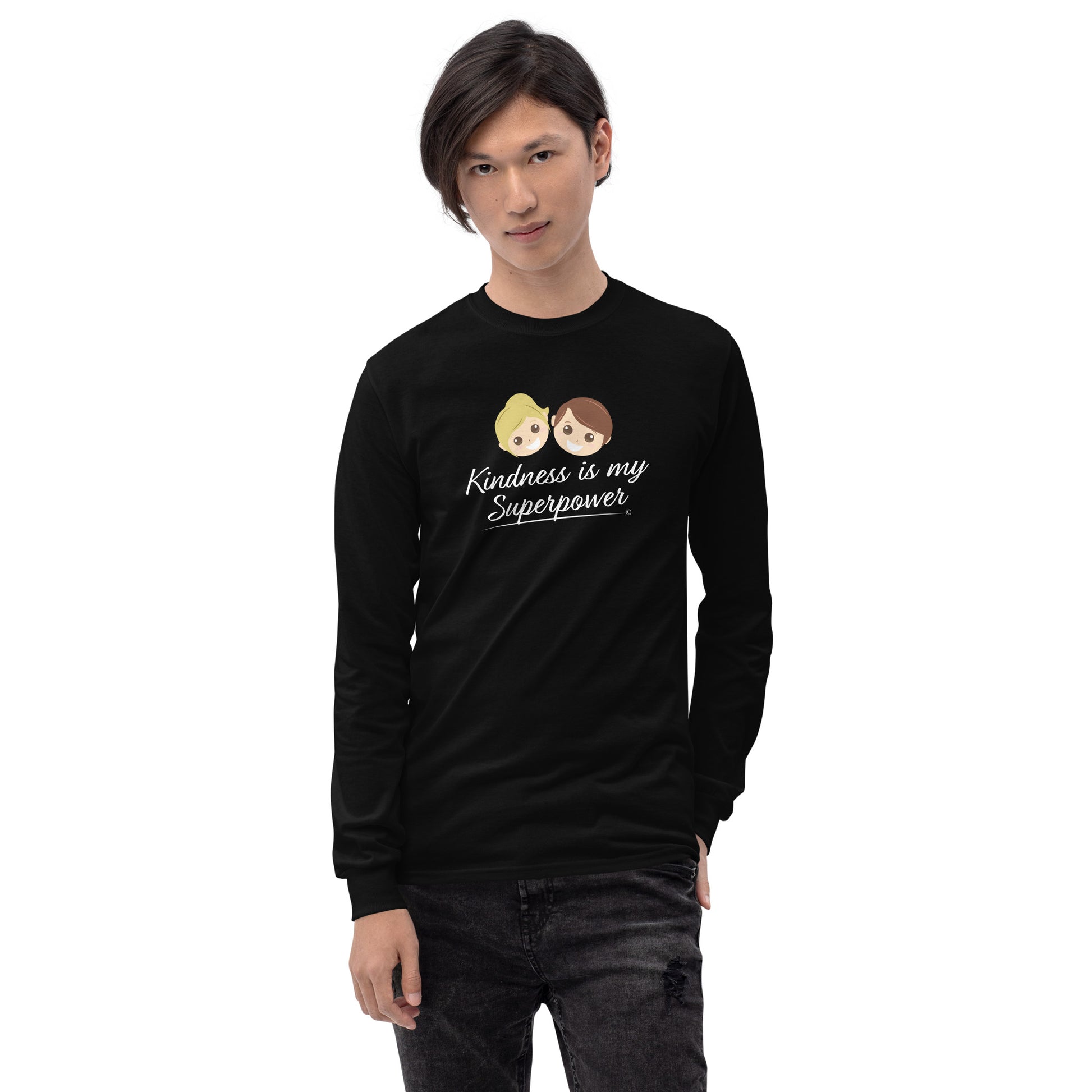 A confident young man wearing a stylish long sleeve shirt in black, featuring the empowering quote 'Kindness is my Superpower' in bold lettering.