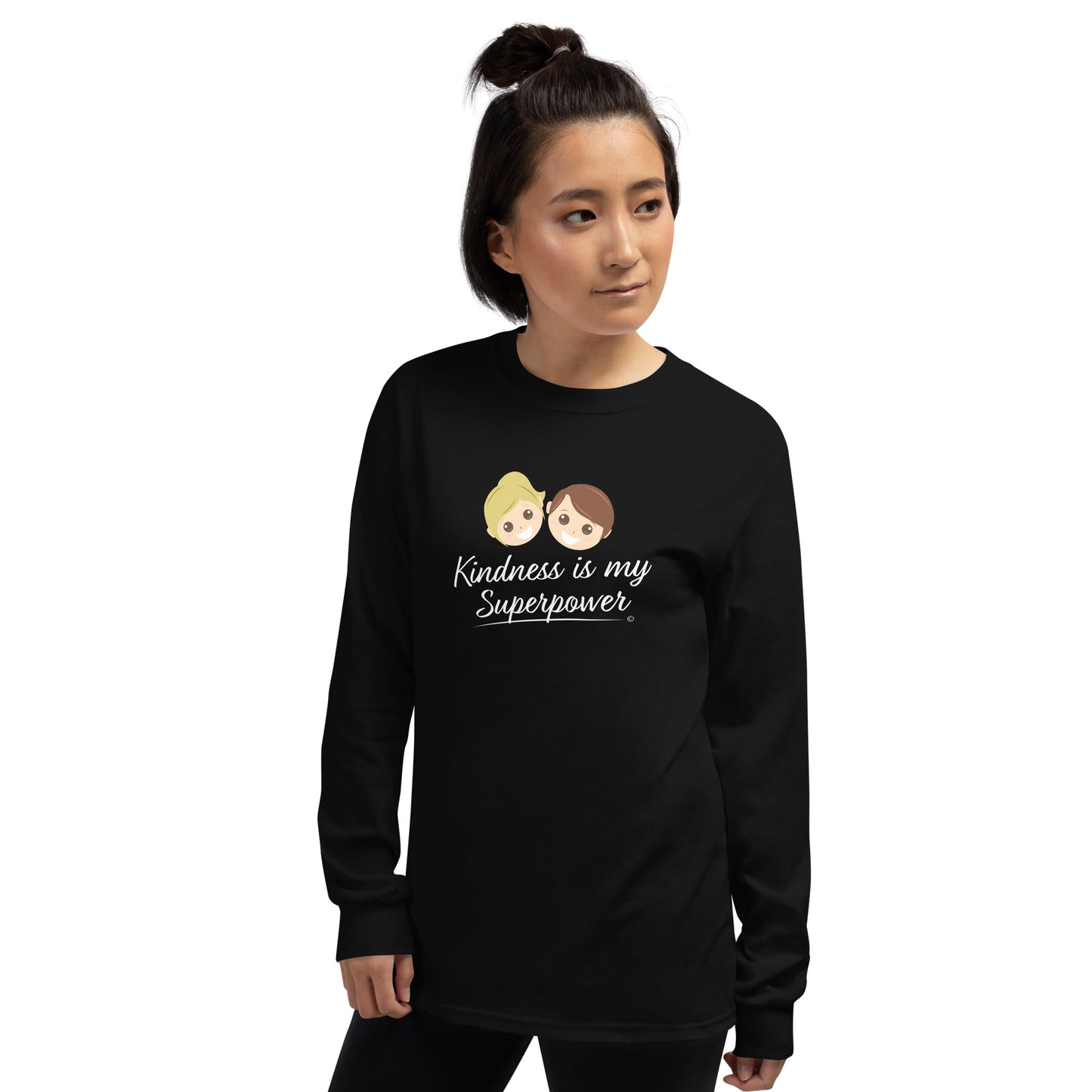 A confident young woman wearing a stylish long sleeve shirt in [black, featuring the empowering quote 'Kindness is my Superpower' in bold lettering.