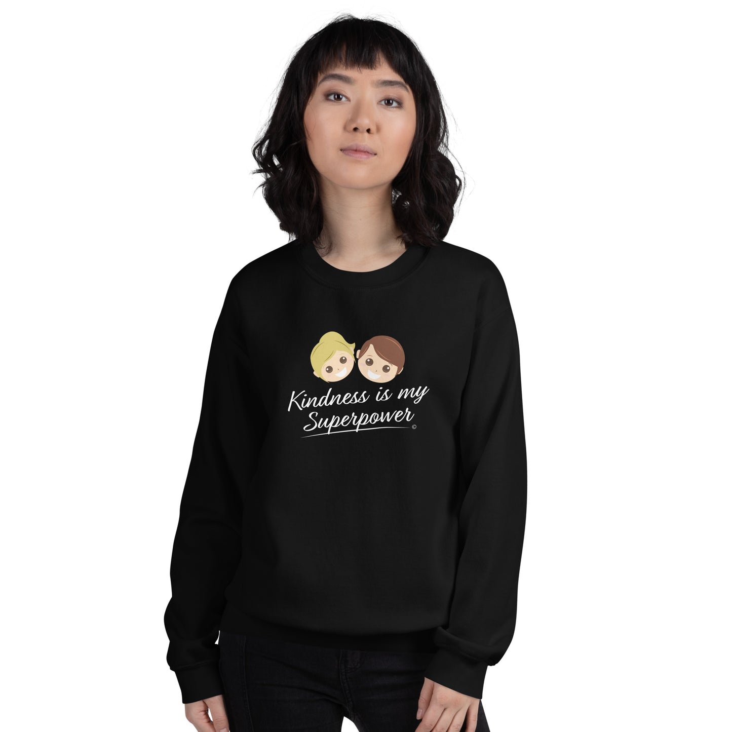 A stylish  woman confidently modeling a cozy unisex sweatshirt in black, both adorned with the empowering quote 'Kindness is my Superpower' in bold lettering.