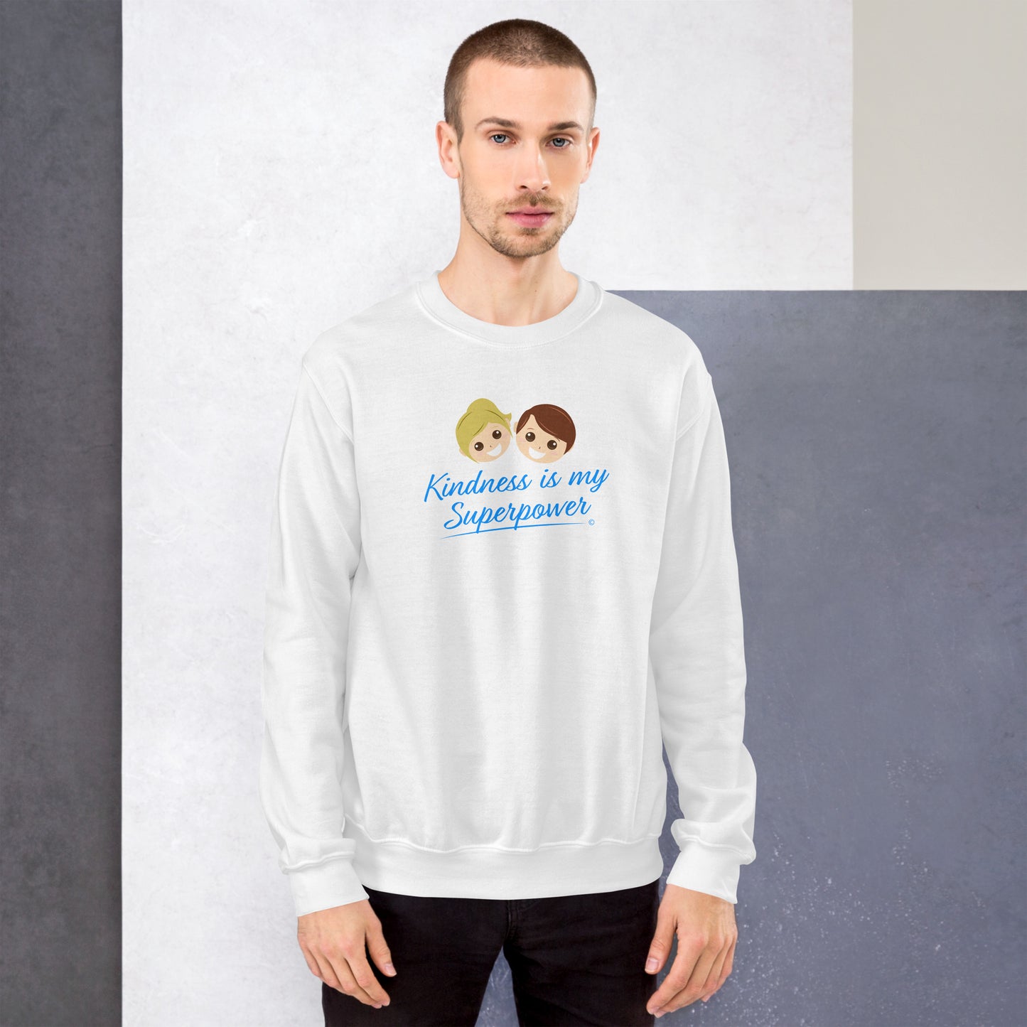 A stylish man confidently modeling a cozy unisex sweatshirt in white,  adorned with the empowering quote 'Kindness is my Superpower' in bold lettering.