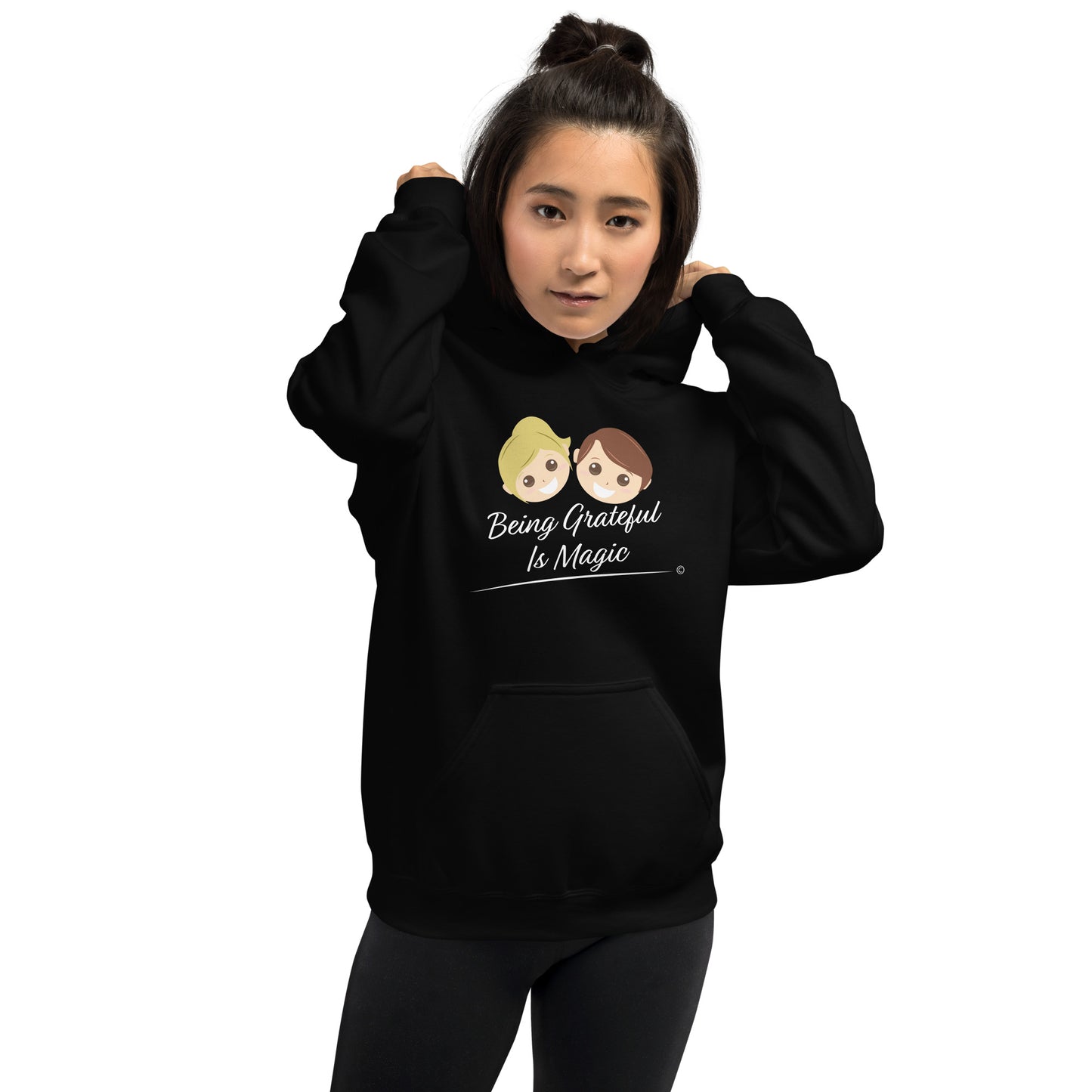 Colorful unisex sweatshirts for sale- Woman model wearing a hoodie with a quote Being Grateful Is Magic