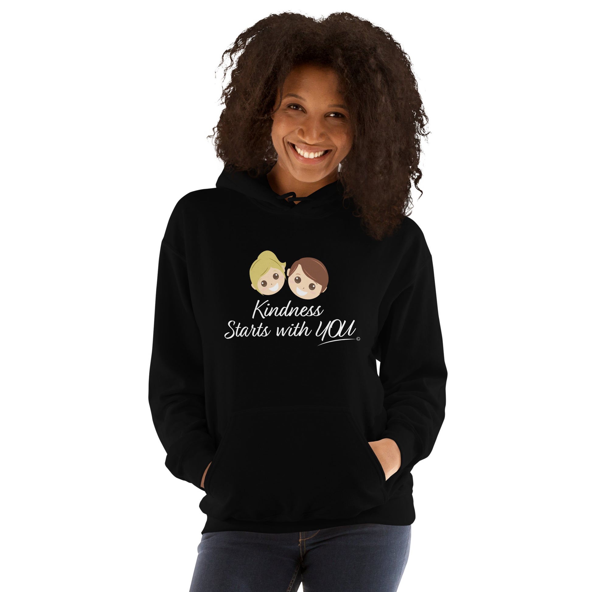 A confident woman modeling a cozy unisex hoodie in black, featuring the uplifting quote 'Kindness Starts with You' in bold lettering.