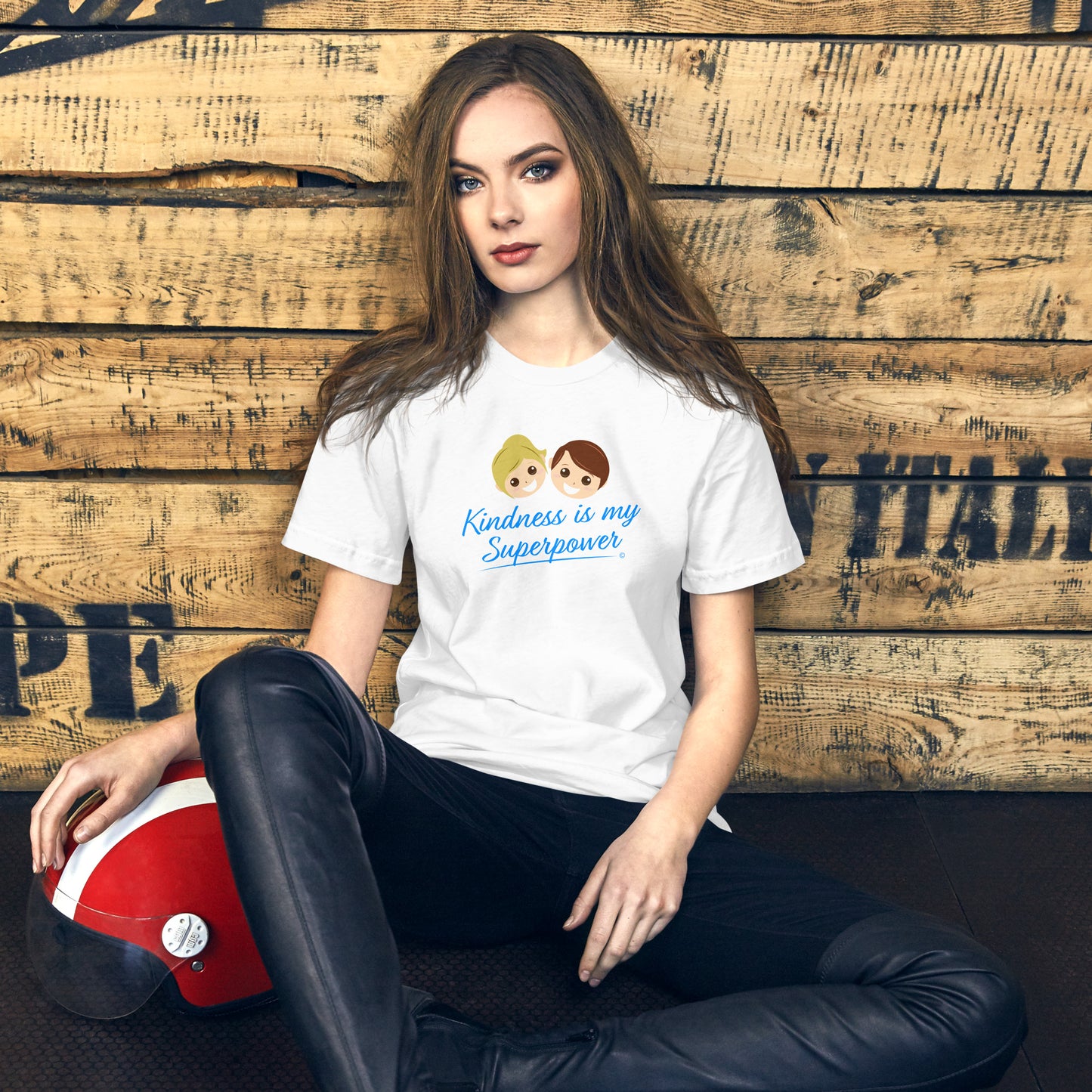 A young lady wearing a white shirt with the empowering quote 'Kindness is my Superpower' in bold lettering. quote 'Kindness is my Superpower' in bold lettering.