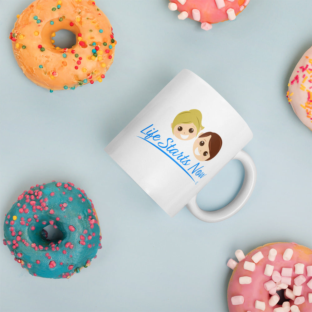 Glossy white latte mug  with donuts in the background