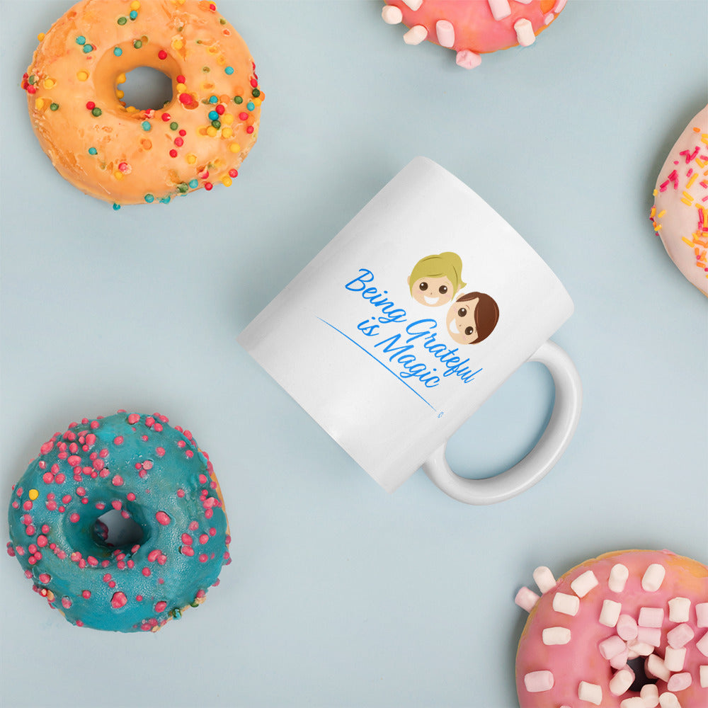 White ceramic mug with donuts on the background