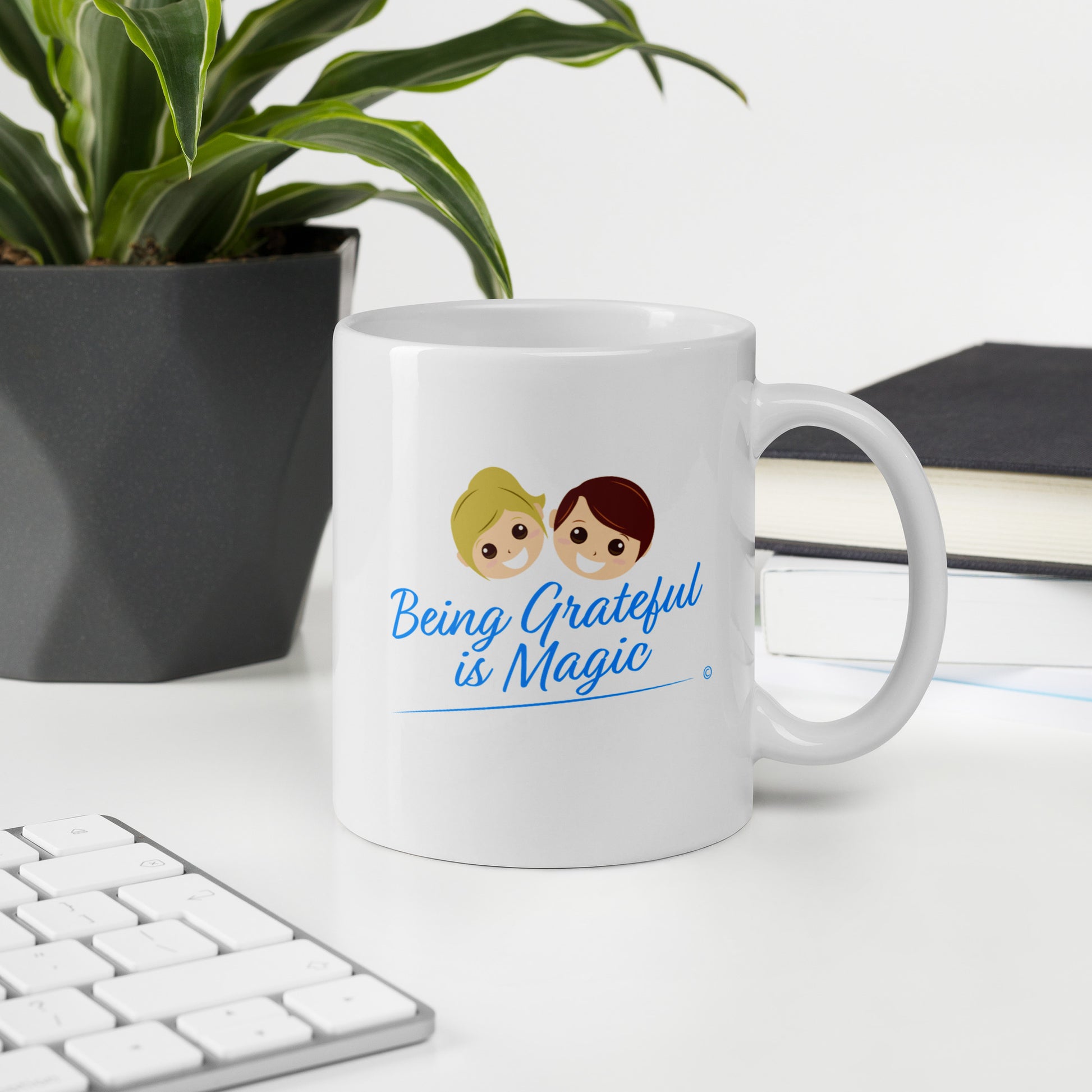 White ceramic mug with green plant on the background