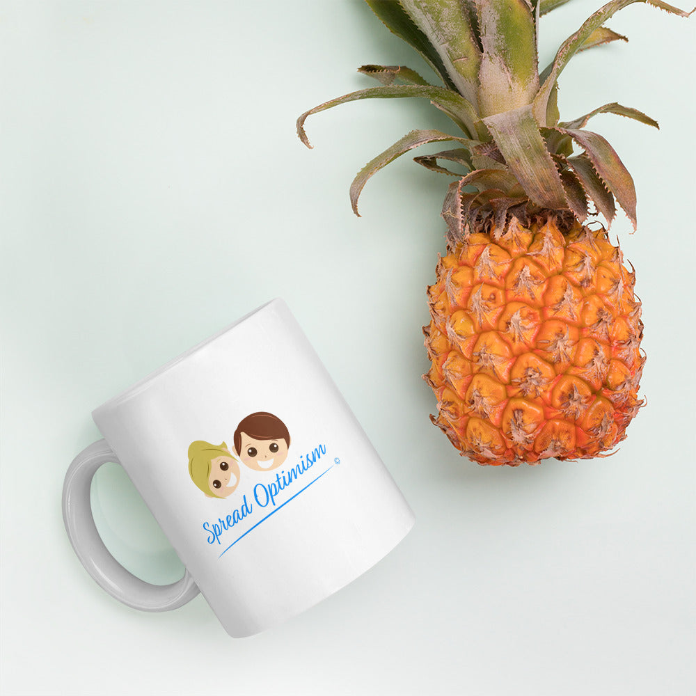 Modern white glossy coffee cups with a pineapple in the background