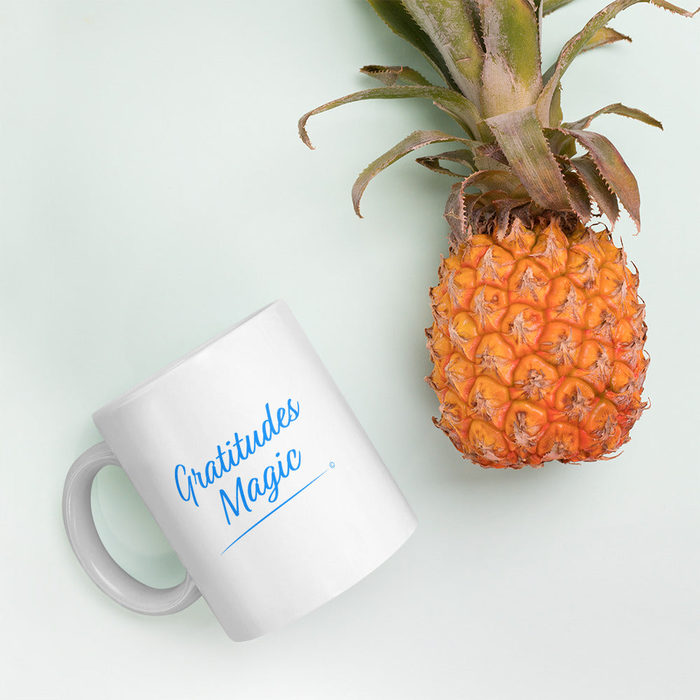 Elegant white ceramic coffee mugs with pineapple in the background