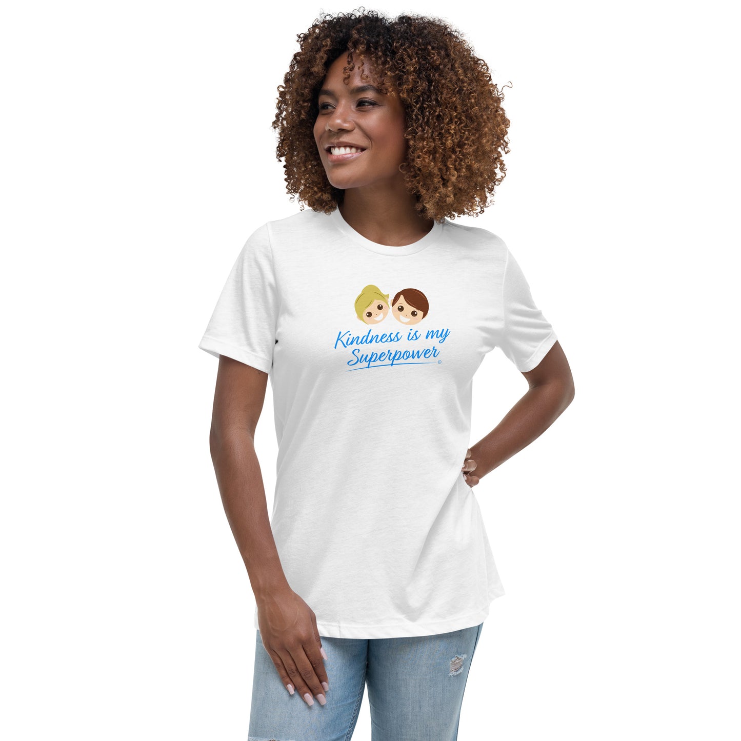 A smiling young woman wearing a white shirt with the empowering quote 'Kindness is my Superpower' in bold lettering.